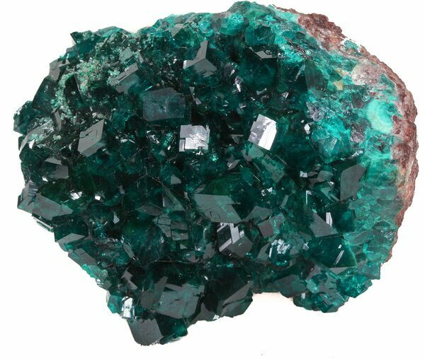 A cluster of vibrant, emerald-green dioptase crystals perched on quartz from the Congo. 